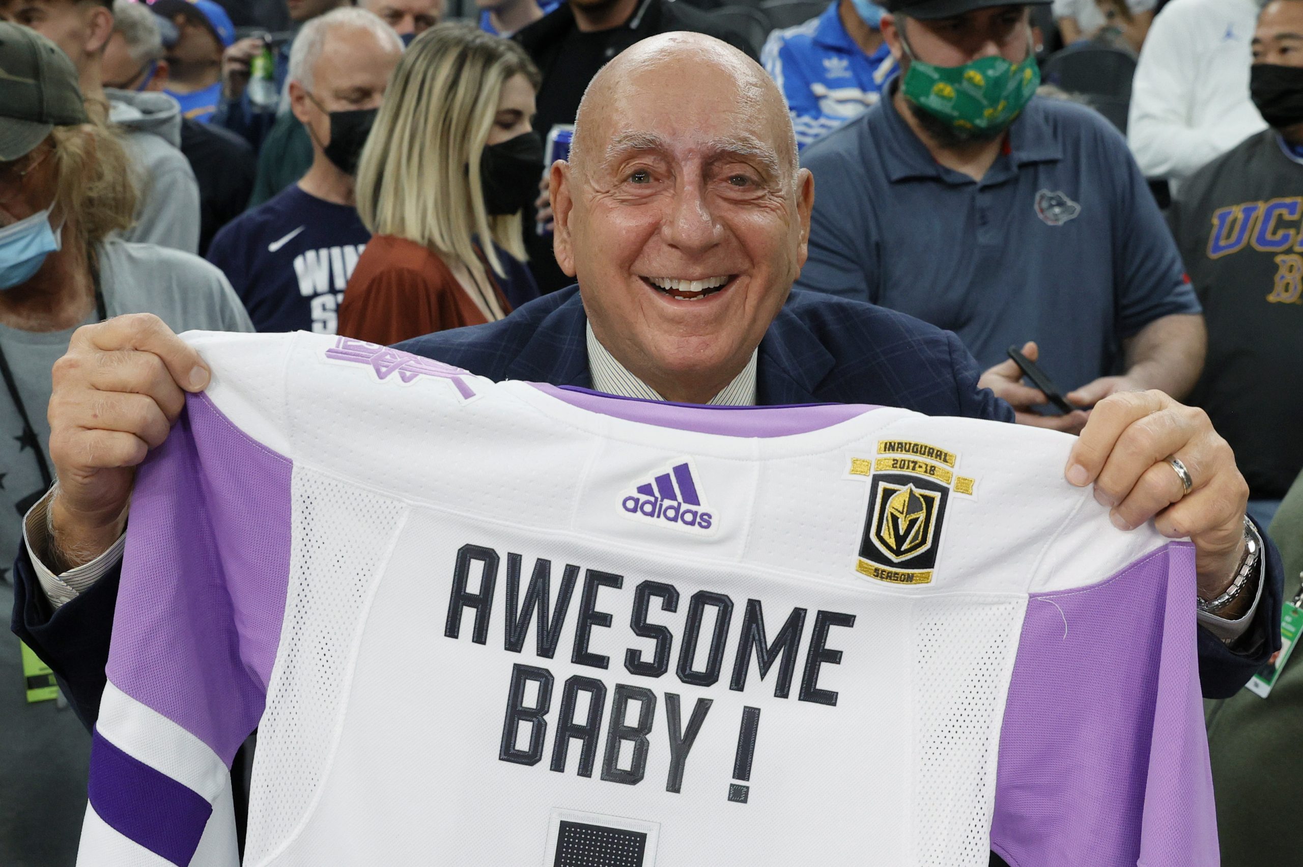 ESPN college basketball analyst Dick Vitale displays a Vegas Golden Knights jersey he was given.