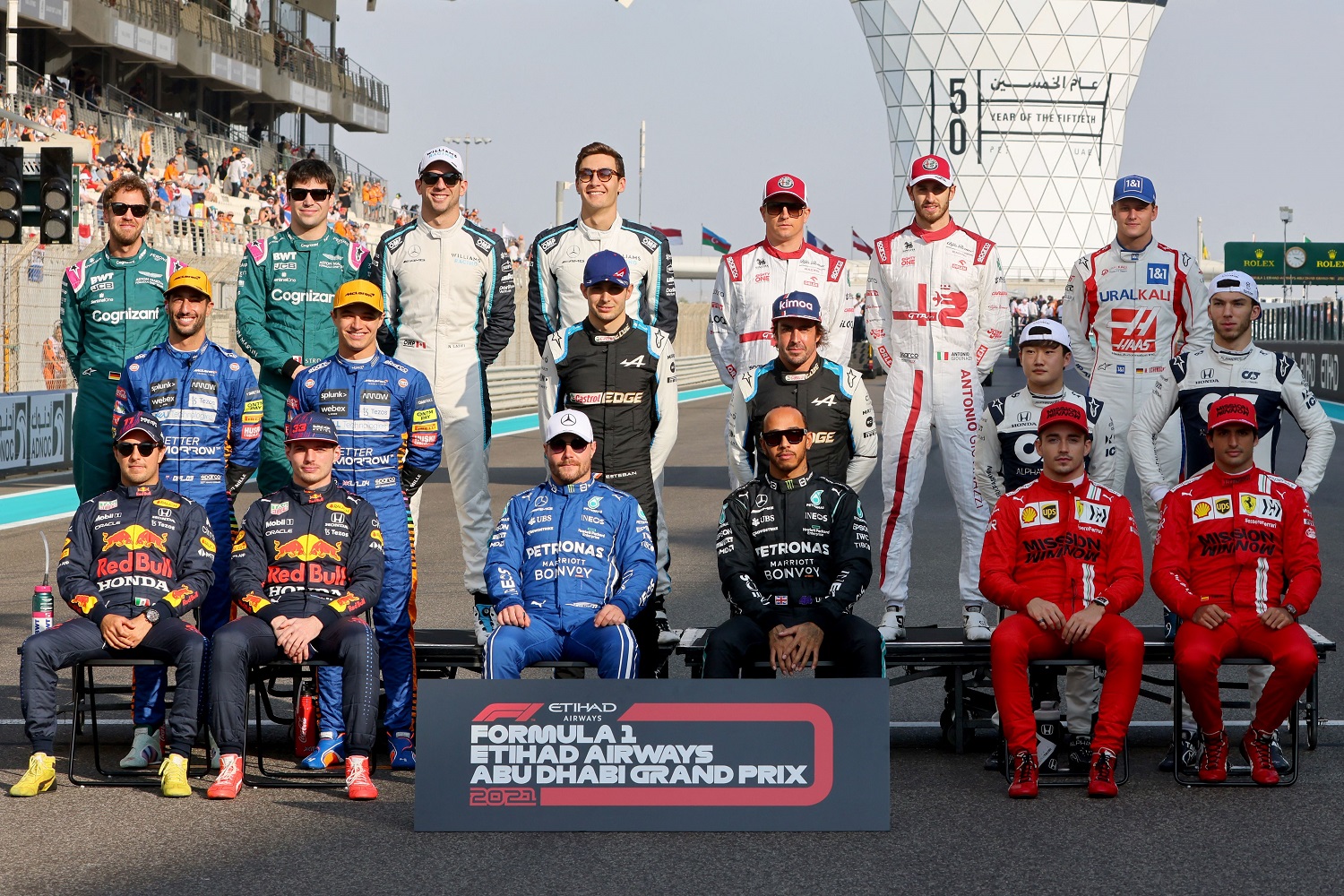 Drivers pose for a picture at the Yas Marina Circuit before the Abu Dhabi Formula 1 Grand Prix on Dec. 12, 2021. | Giuseppe Cacace / AFP via Getty Images