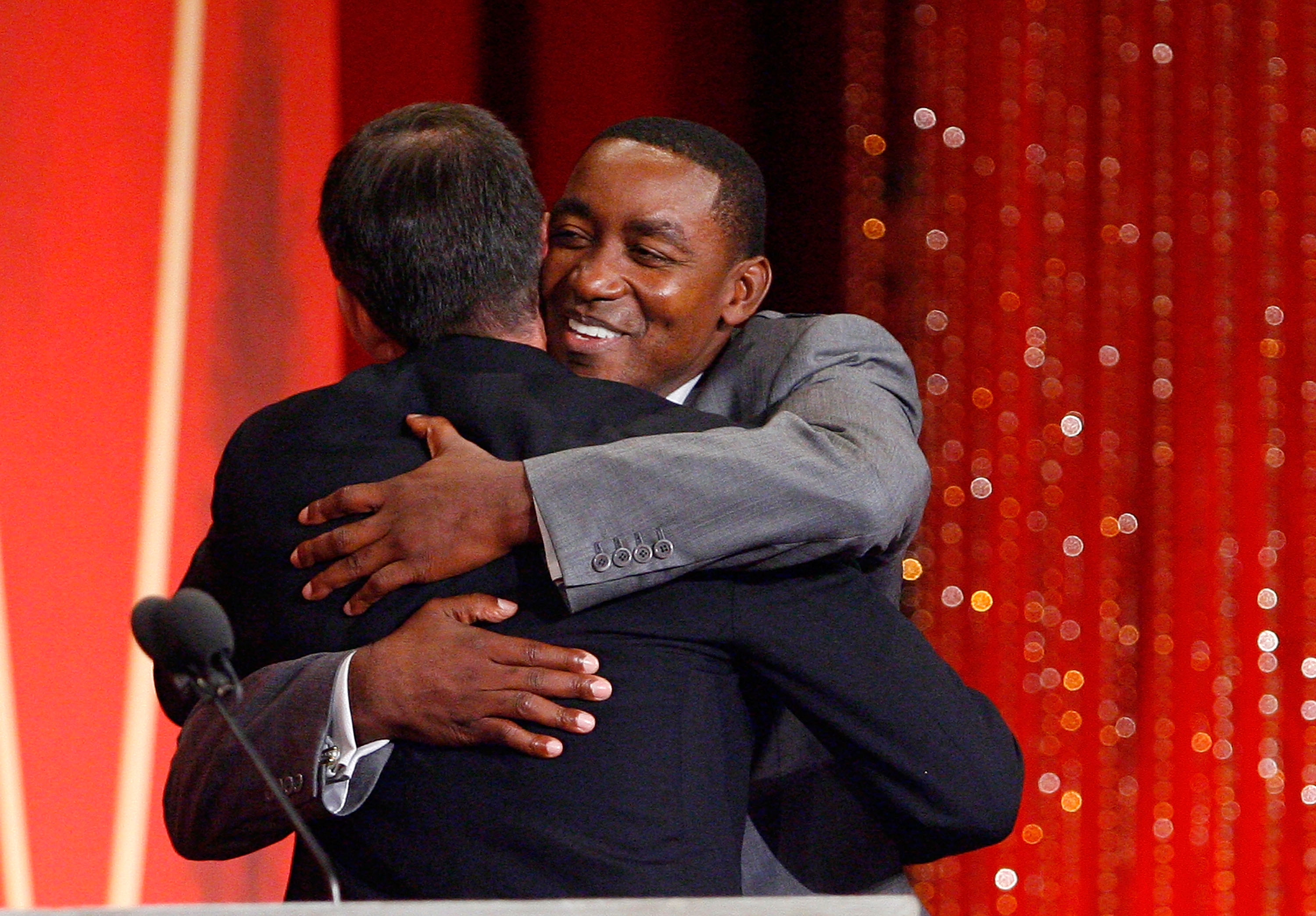 Detroit Pistons icon Isiah Thomas hugs Utah Jazz legend John Stockton as he presented Stockton to the Naismith Memorial Basketball Hall of Fame in 2009
