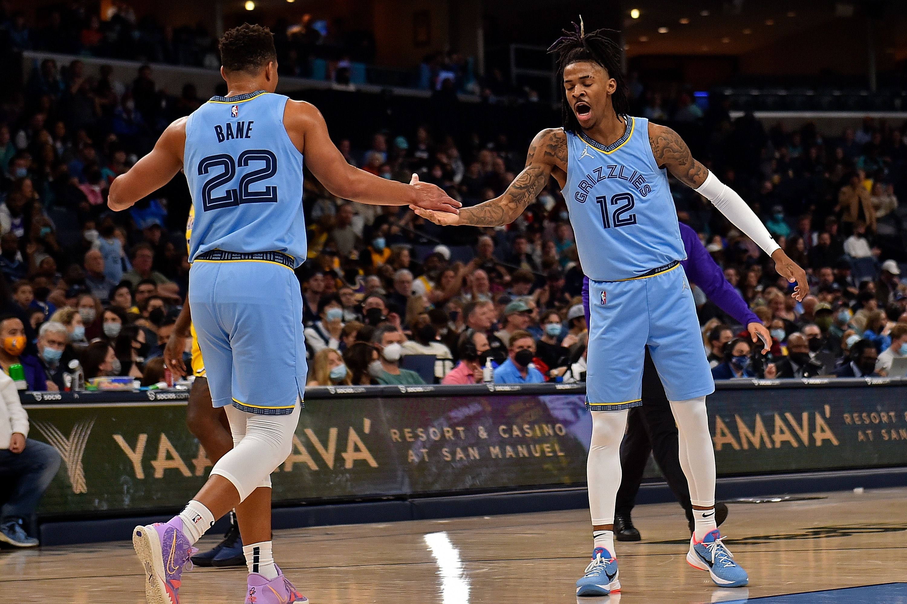 Memphis Grizzlies guards Ja Morant and Desmond Bane react during an NBA game against the Los Angeles Lakers
