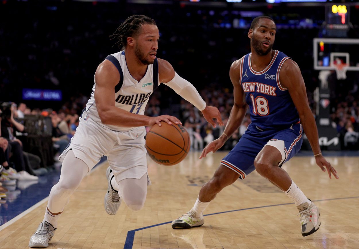 Dallas Mavericks guard Jalen Brunson drives on New York Knicks guard Alec Burks during an NBA game in January 2022