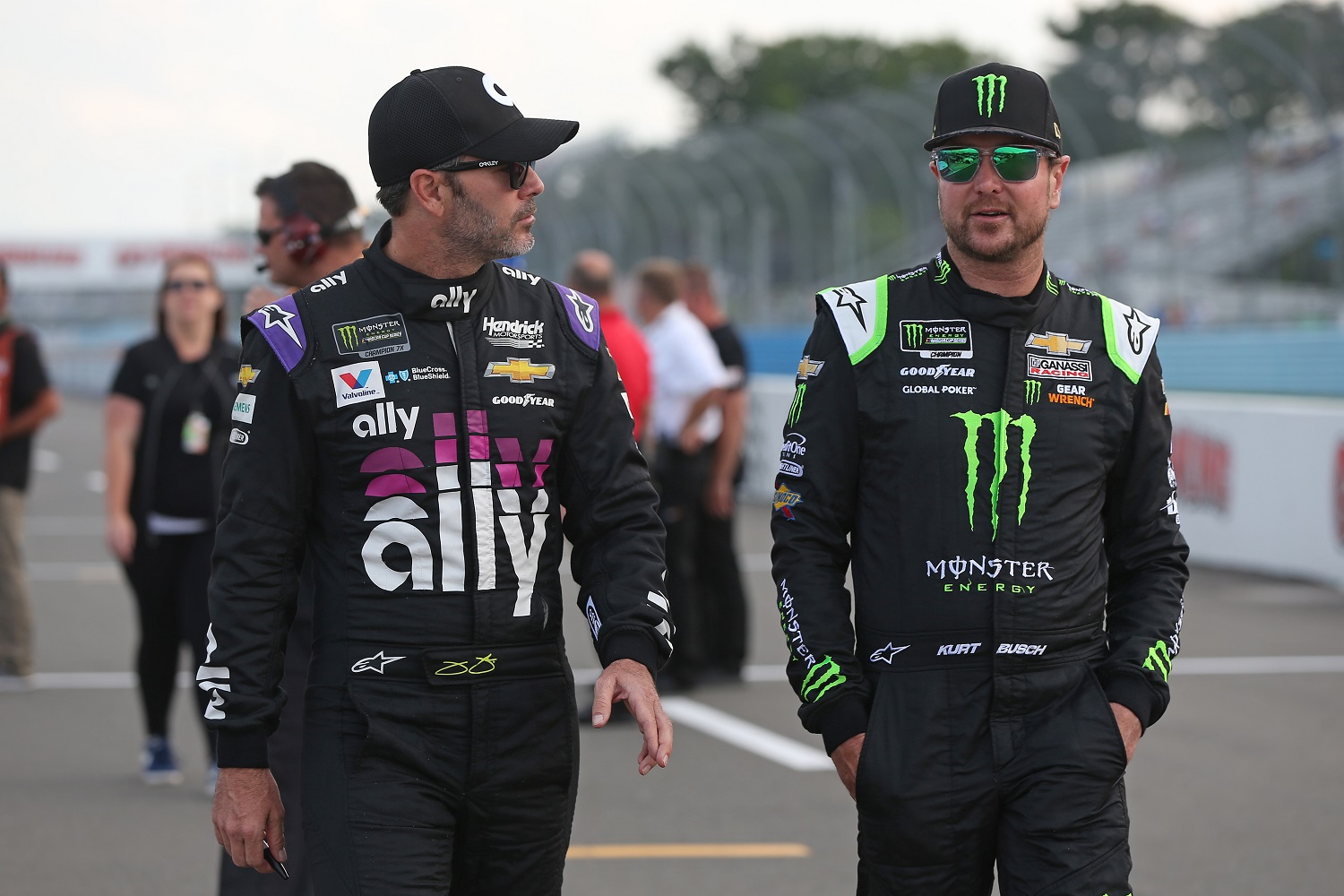 Drivers Jimmie Johnson and Kurt Busch talk during qualifying for the Monster Energy NASCAR Cup Series Go Bowling at The Glen at Watkins Glen International on Aug. 3, 2019. | Matt Sullivan/Getty Images