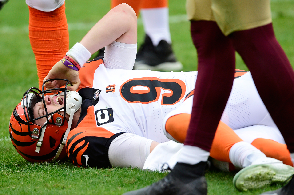 Joe Burrow of the Cincinnati Bengals reacts after injuring his left knee in the third quarter against the Washington Football Team.