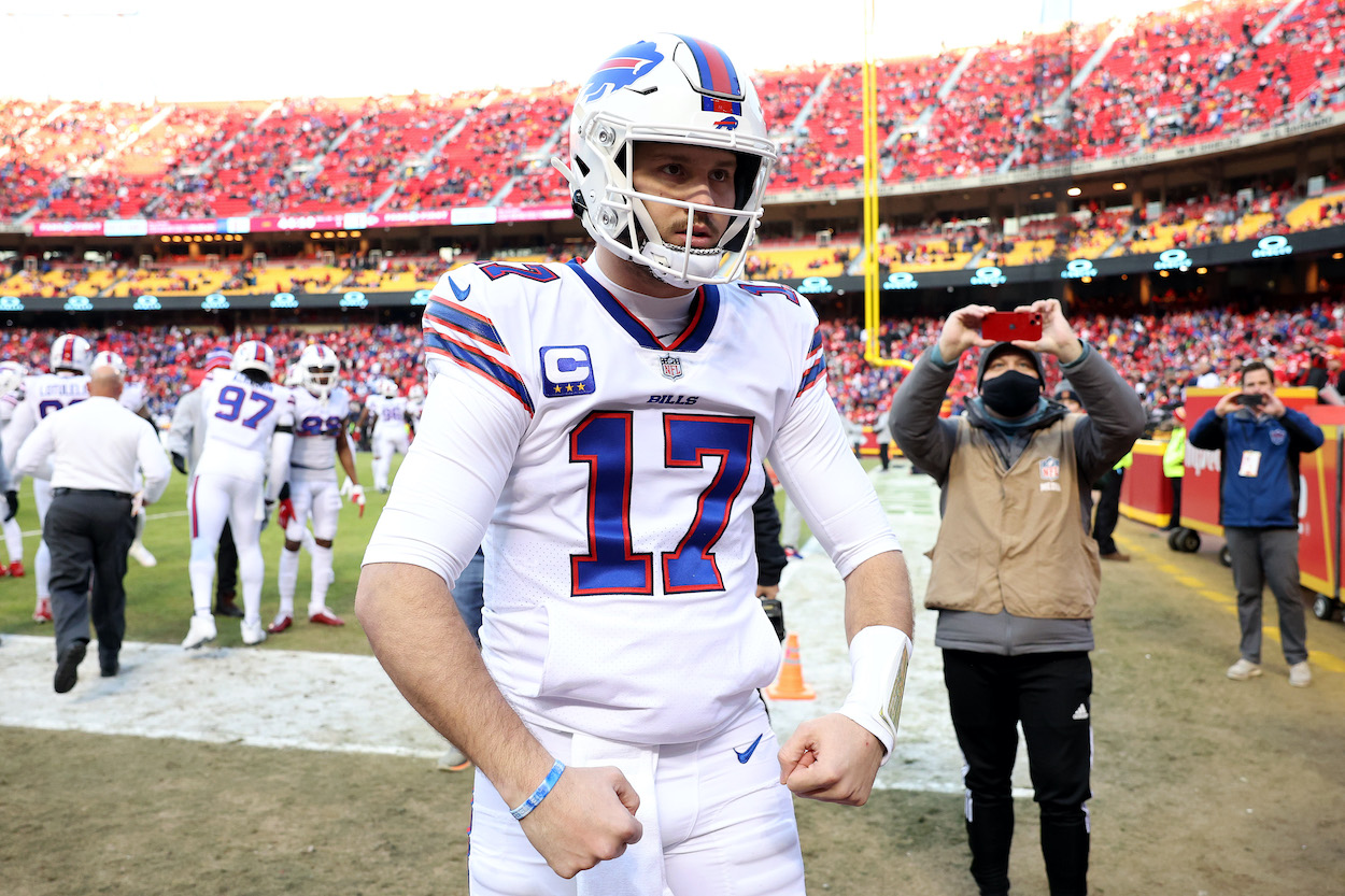 Josh Allen of the Buffalo Bills flexes as his teammates take the field prior to the AFC Divisional Playoff game against the Kansas City Chiefs at Arrowhead Stadium on January 23, 2022 in Kansas City, Missouri.