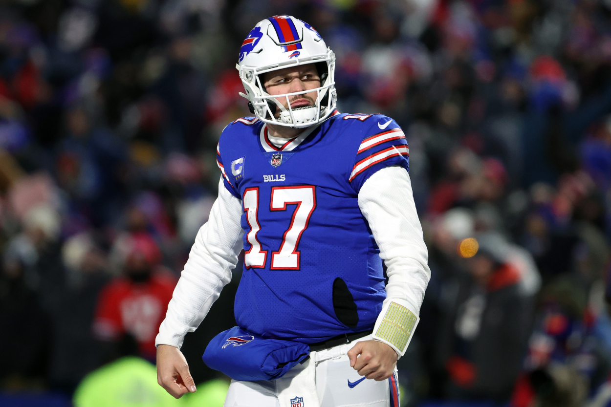 Josh Allen of the Buffalo Bills celebrates after throwing a touchdown pass against the New England Patriots.