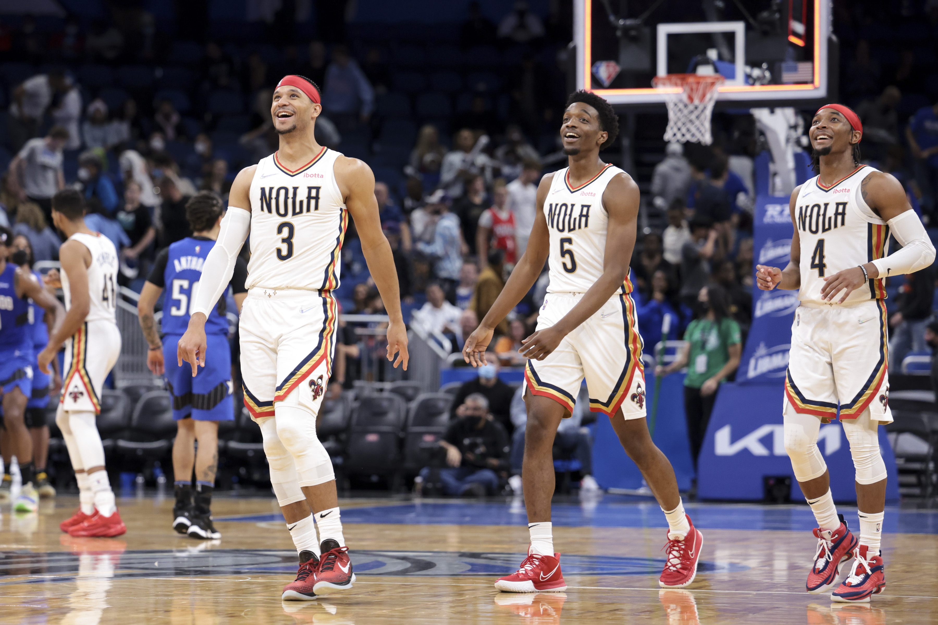 L-R: Josh Hart, Herbert Jones, and Devonte' Graham of the New Orleans Pelicans react during an NBA game against the Orlando Magic