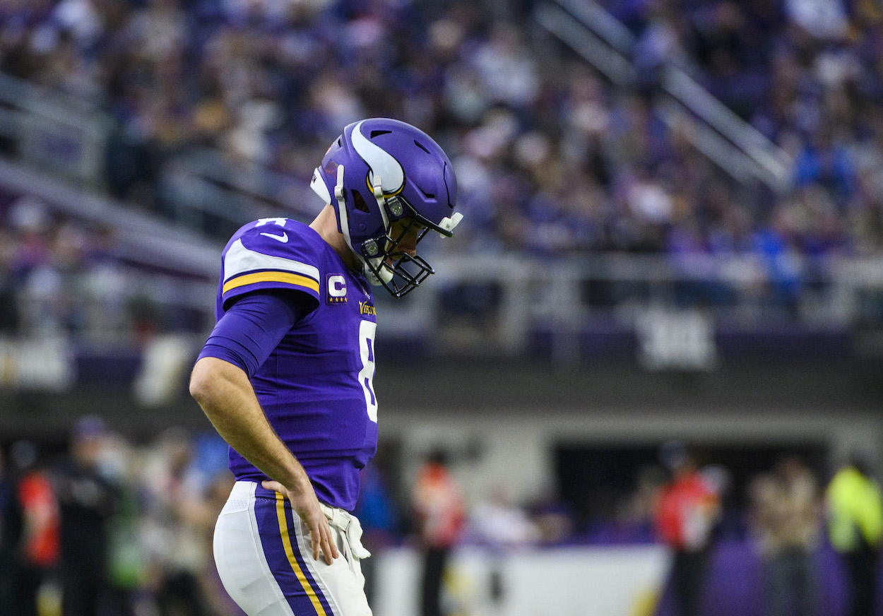 Kirk Cousins of the Minnesota Vikings reacts after a play in the first quarter of the game against the Los Angeles Rams at U.S. Bank Stadium on December 26, 2021 in Minneapolis, Minnesota.