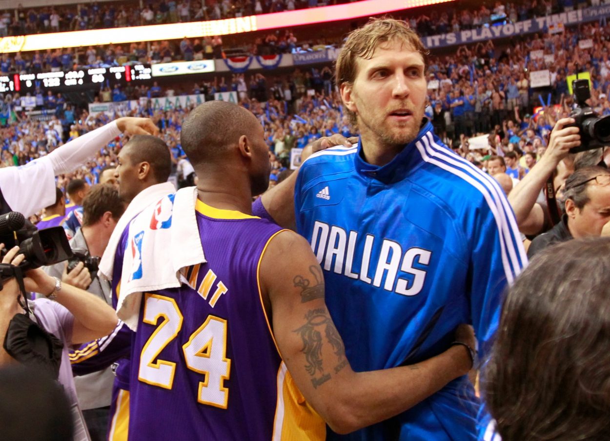 Los Angeles Lakers legend Kobe Bryant embraces Dallas Mavericks great Dirk Nowitzki at the conclusion of a 2011 playoff series