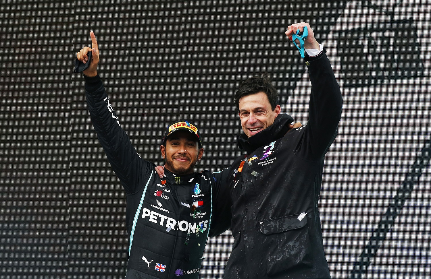 Lewis Hamilton of Mercedes GP celebrates winning a seventh Formula 1 World Drivers' Championship with team principal Toto Wolff on the podium after the Grand Prix of Turkey on Nov. 15, 2020.