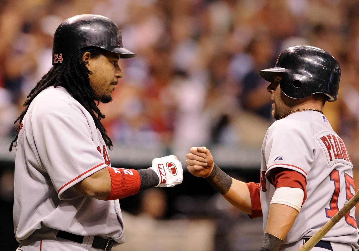 Boston Red Sox teammates Manny Ramirez (L) and Dustin Pedroia in 2008.