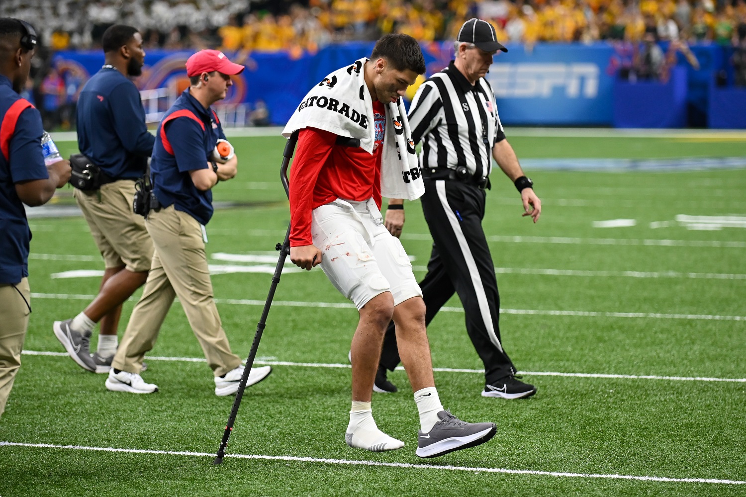 Ole Miss quarterback Matt Corral on crutches after being injured in the first half of the college football game against Baylor on Jan. 1, 2022.