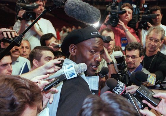 Chicago Bulls great Michael Jordan speaks to reporters after a workout during the 1997 NBA Finals