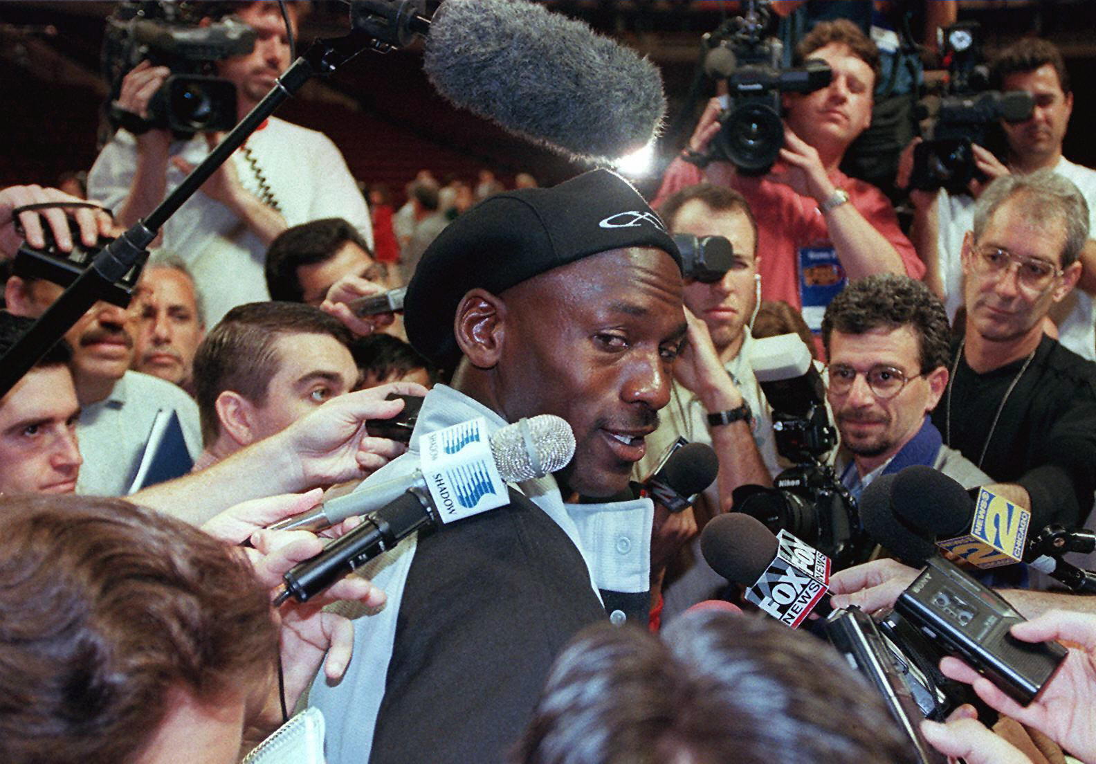 Chicago Bulls great Michael Jordan speaks to reporters after a workout during the 1997 NBA Finals