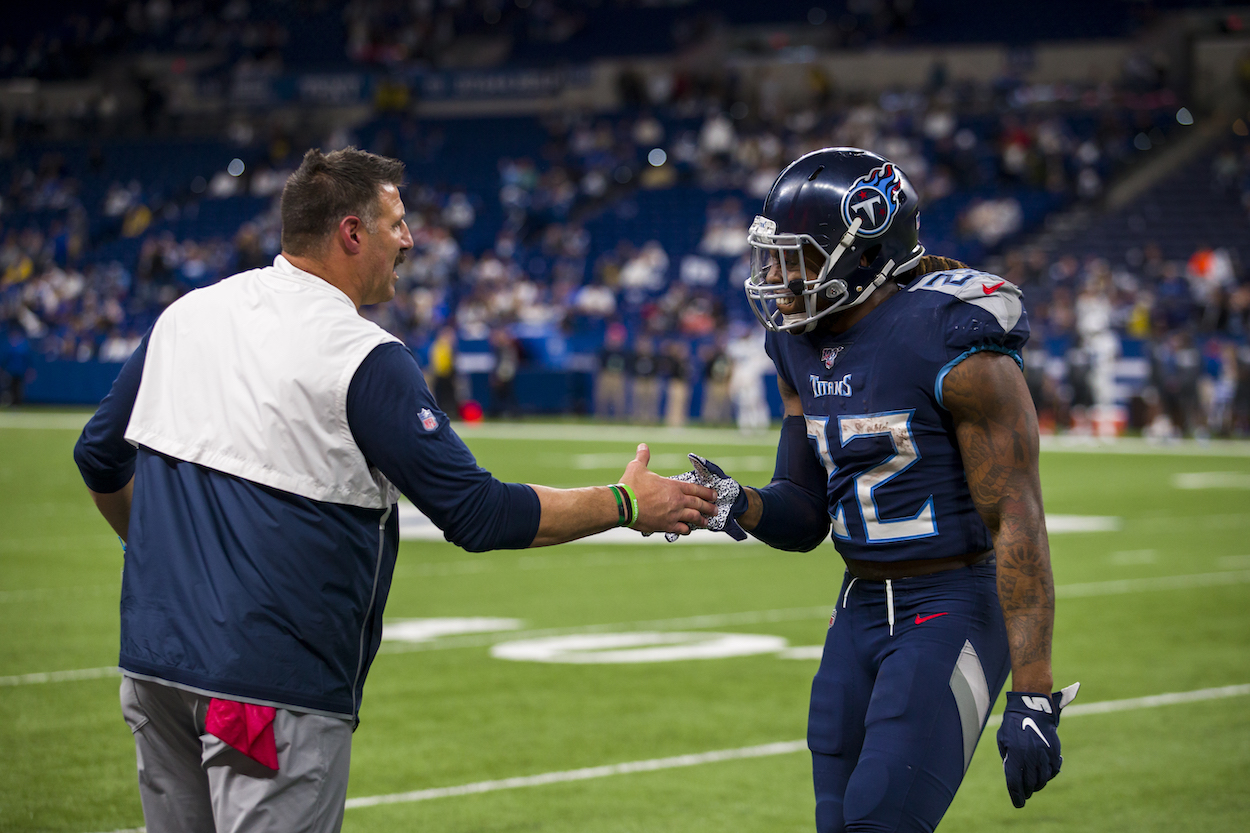 Titans head coach Mike Vrabel shakes hands with Derrick Henry