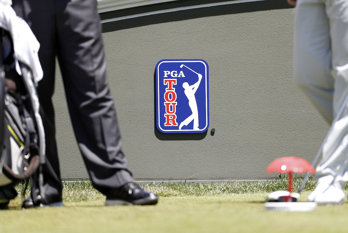 PGA Tour logo is displayed on a wall at the Travelers Championship
