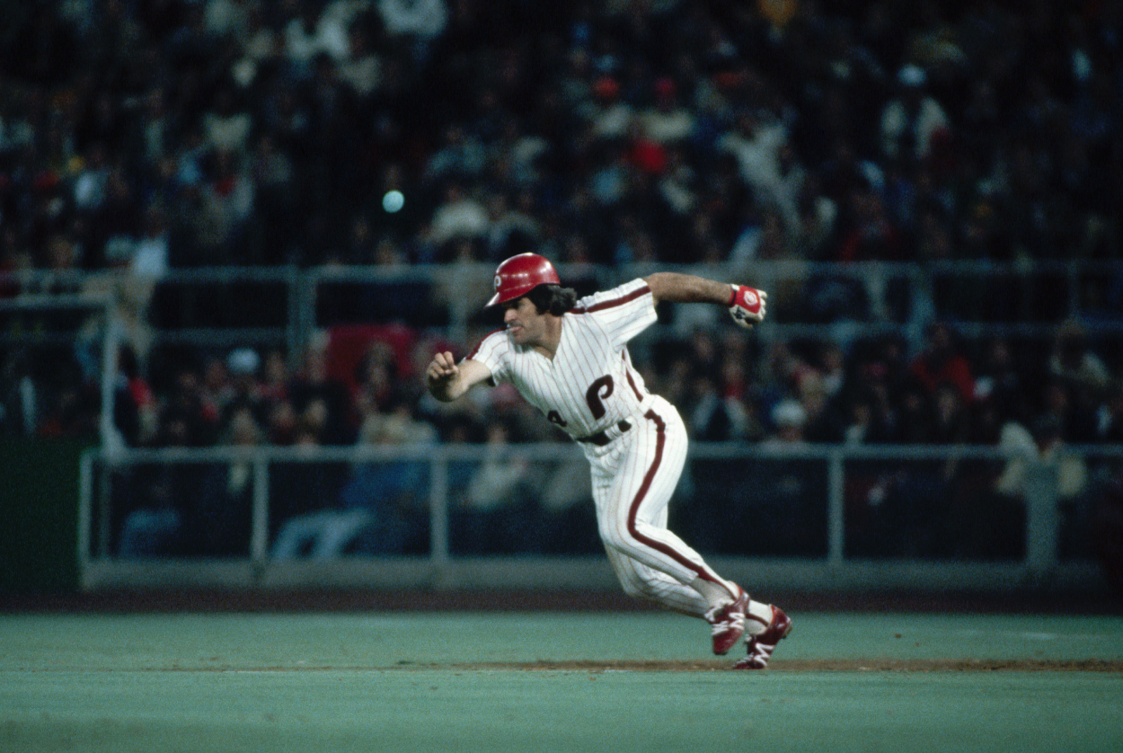 Pete Rose hustles to steal a base.