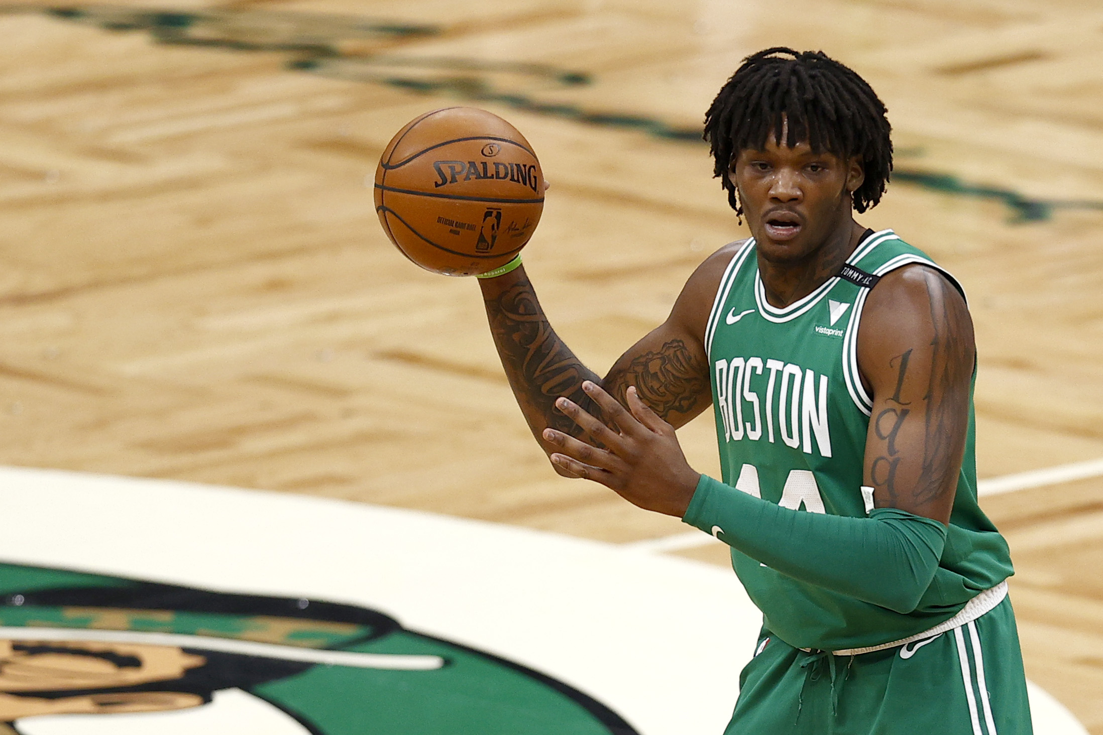 Boston Celtics center Robert Williams III holds the ball during an NBA game in February 2021