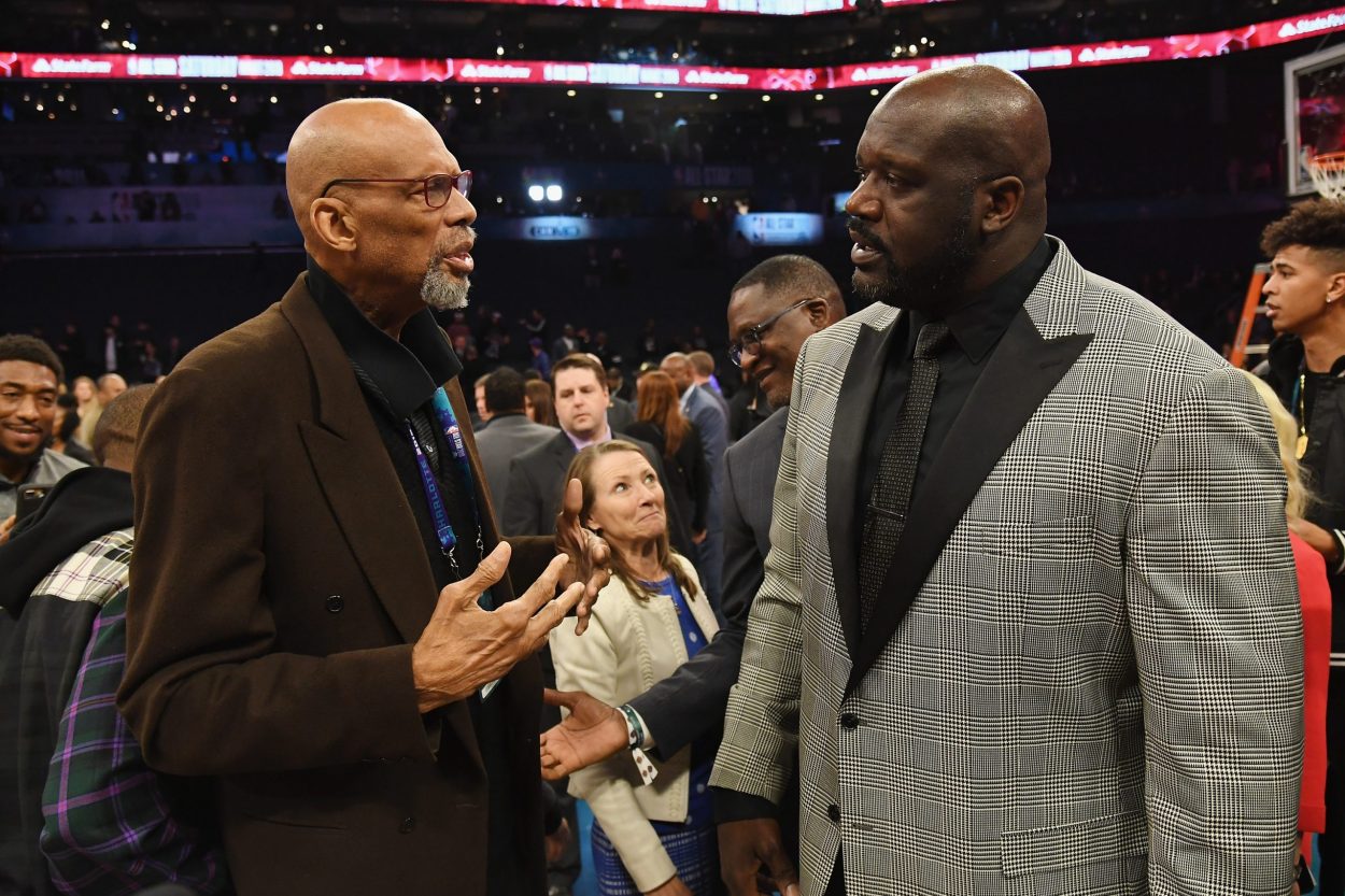 Former Los Angeles Lakers greats Kareem Abdul-Jabbar (L) and Shaquille O'Neal talk during 2019 All-Star Saturday Night