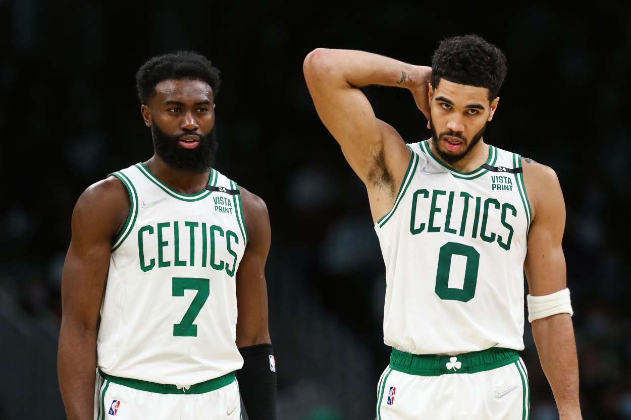 Jaylen Brown #7 and Jayson Tatum #0 of the Boston Celtics look on during a game.
