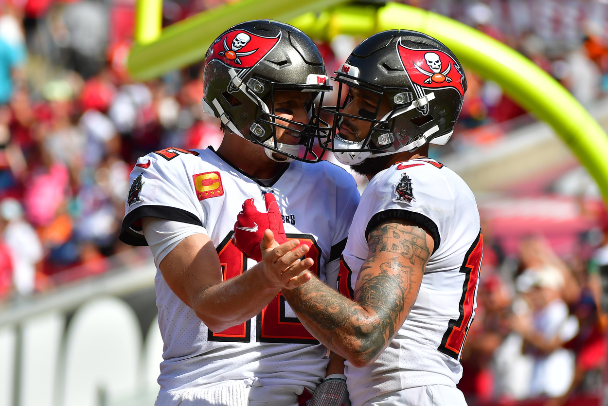 Tampa Bay Buccaneers teammates Tom Brady (L) and Mike Evans are trying to win a Super Bowl for the second straight year.