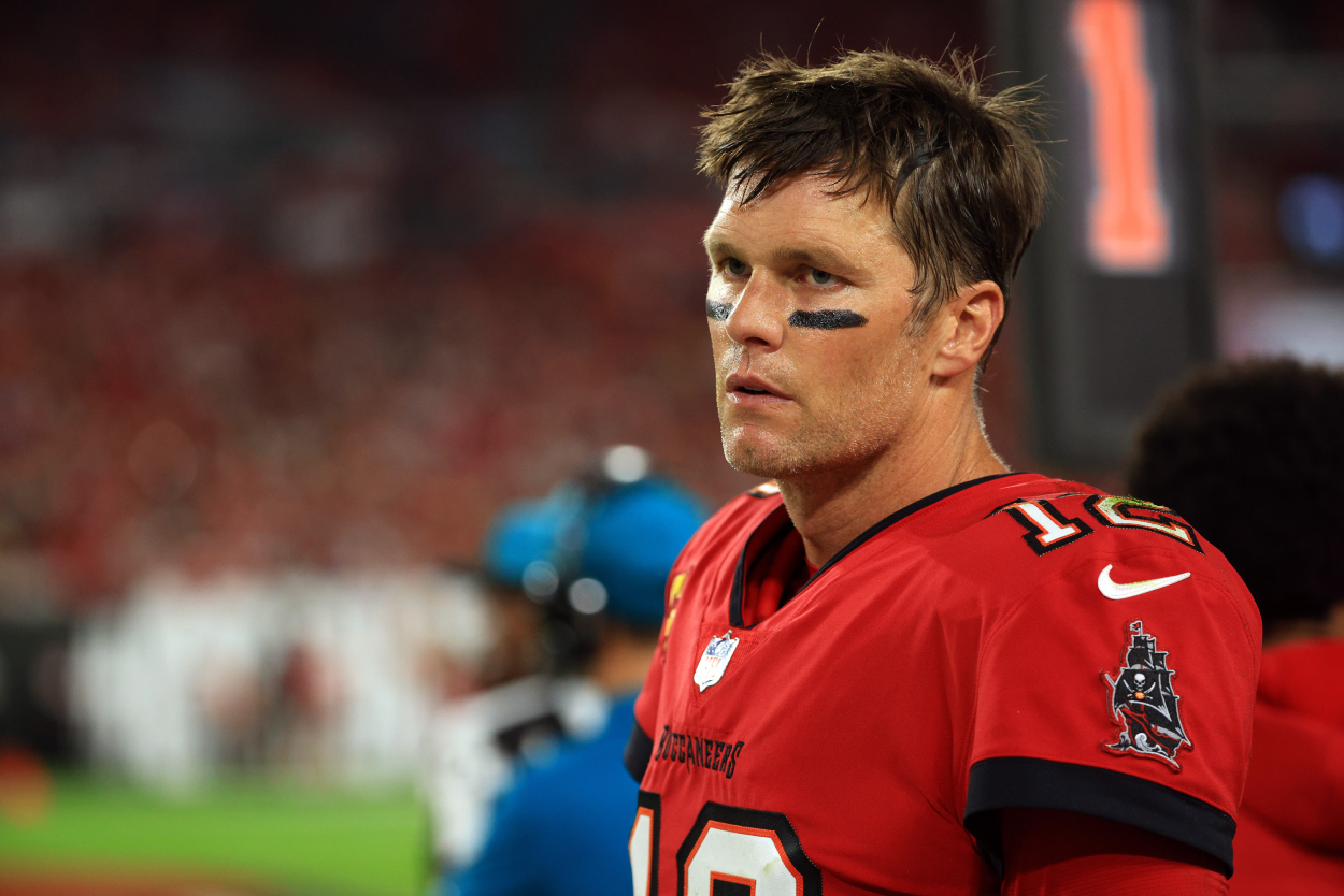Tom Brady of the Tampa Bay Buccaneers watches from the sidelines .