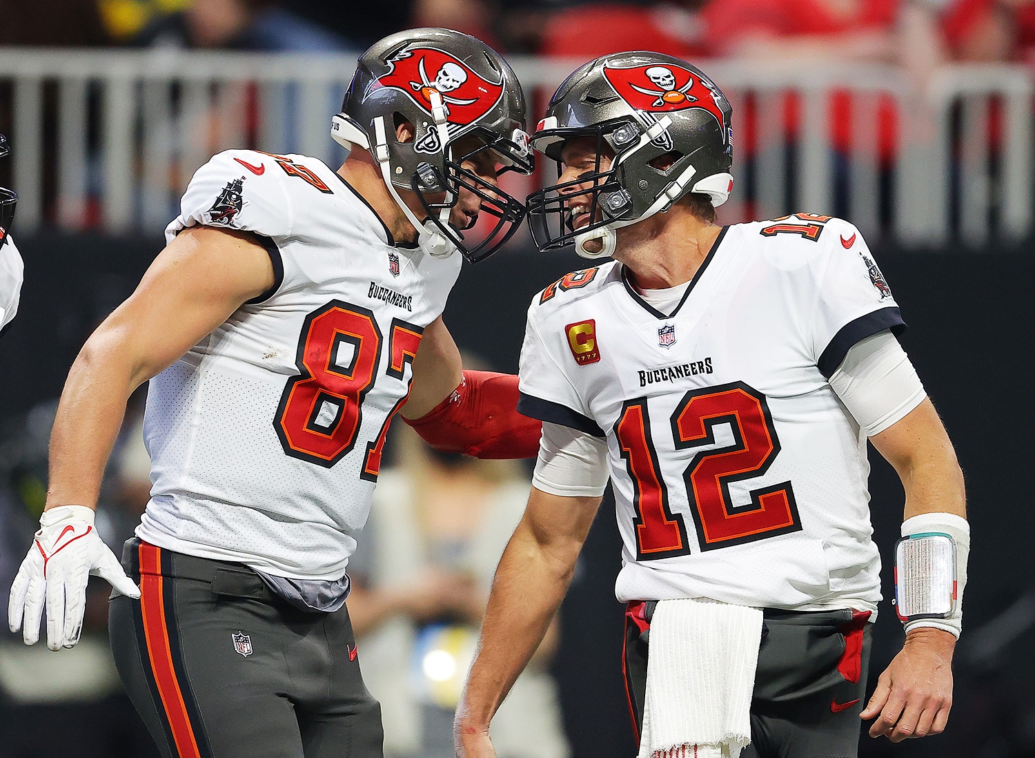 Rob Gronkowski of the Tampa Bay Buccaneers celebrates his touchdown against the Atlanta Falcons with teammate Tom Brady during the second quarter at Mercedes-Benz Stadium on Dec. 5, 2021.