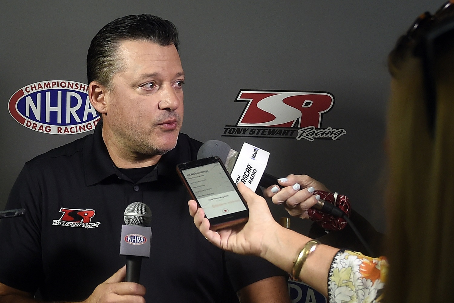 Tony Stewart answers questions from media after the press conference held at the zMAX Dragway on Oct. 14, 2021, in Concord, North Carolina. | Mike Comer/Getty Images