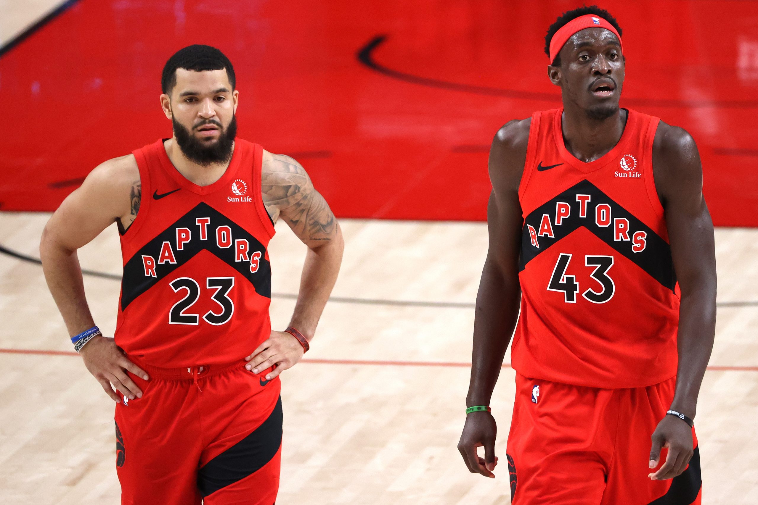 Toronto Raptors stars Fred VanVleet and Pascal Siakam rest during a break in the action in a recent game against the Portland Trail Blazers.