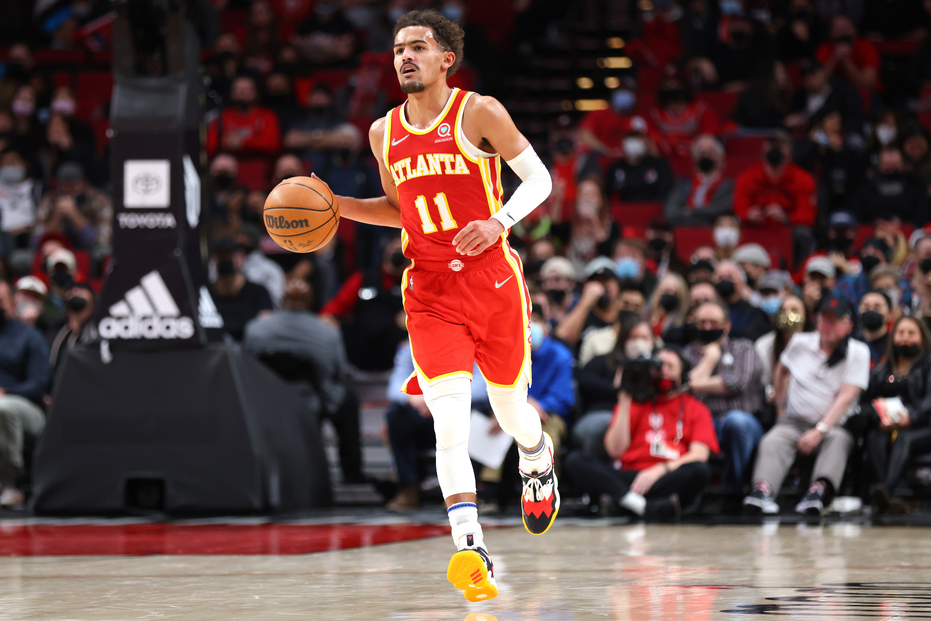 Atlanta Hawks point guard Trae Young dribbles the ball during a game against the Portland Trail Blazers