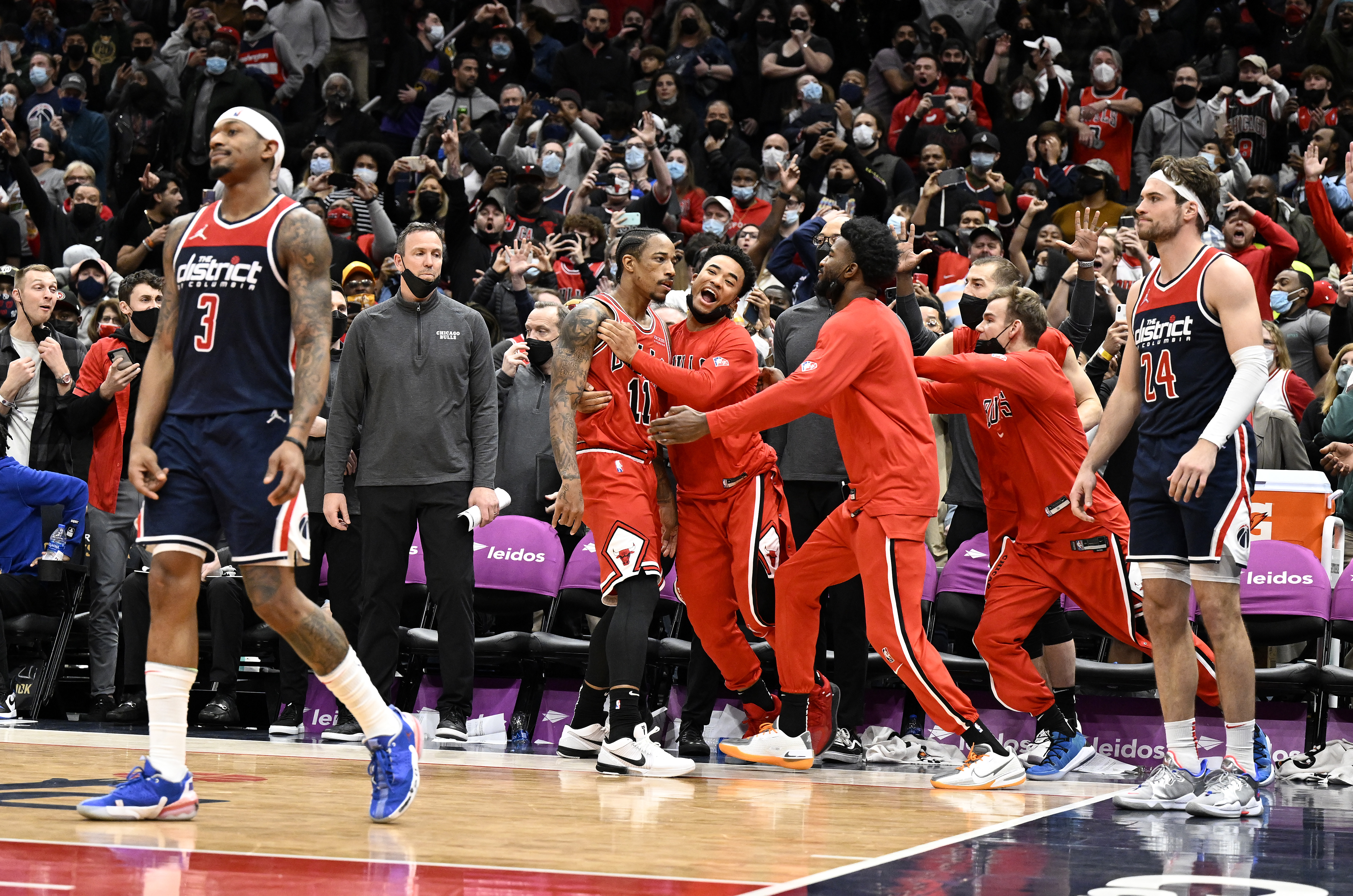 Chicago Bulls star DeMar DeRozan celebrates his game-winner against the Washington Wizards as Bradley Beal and Corey Kispert look on in dismay
