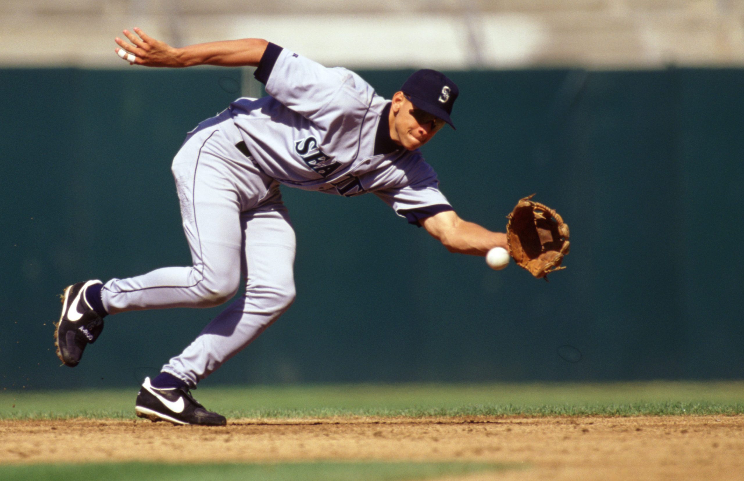 Alex Rodriguez of the Seattle Mariners fields during an MLB game versus the Oakland Athletics in 1996.