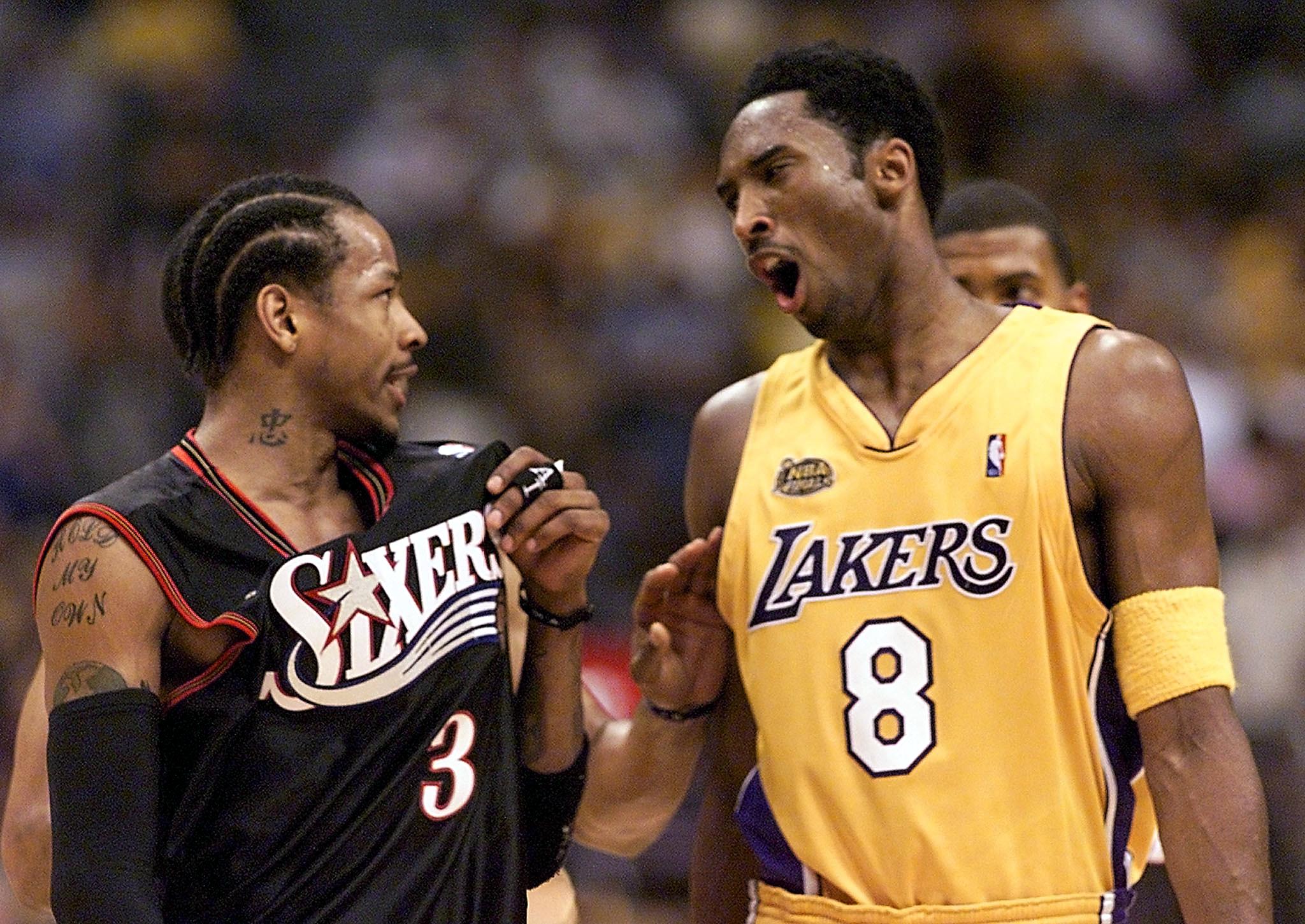 Former Philadelphia 76ers legend Allen Iverson talks to Los Angeles Lakers icon Kobe Bryant during the 2001 NBA Finals
