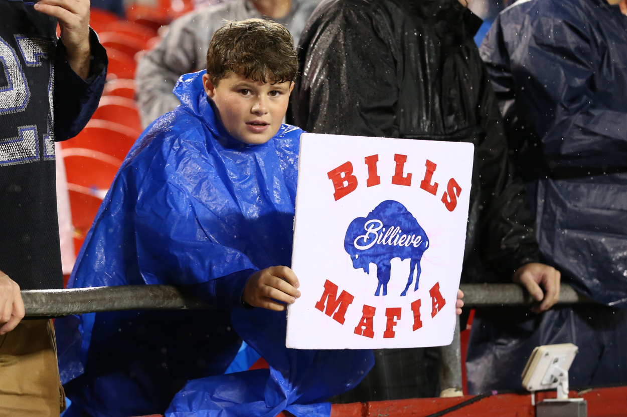 A young fan holds a Bills Mafia sign during an NFL football game between the Buffalo Bills and Kansas City Chiefs.