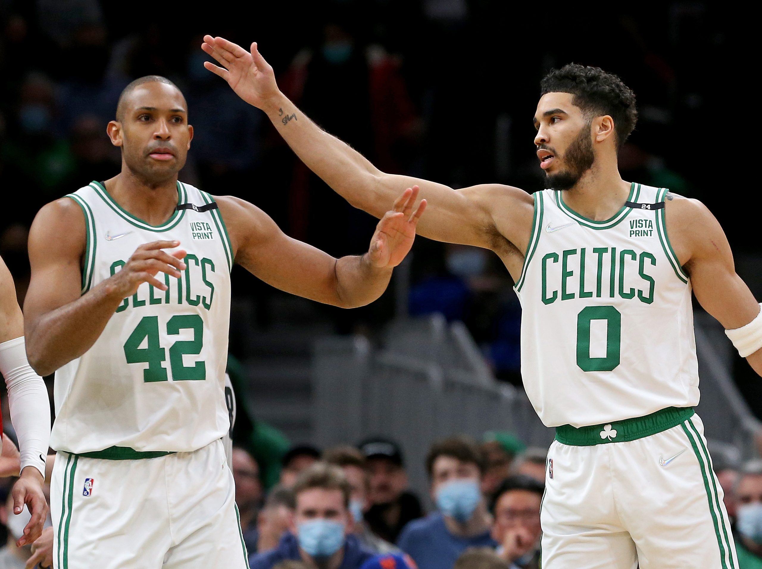 Al Horford #42 and Jayson Tatum #0 of the Boston Celtics celebrate during the first half of the NBA game against the Detroit Pistons.