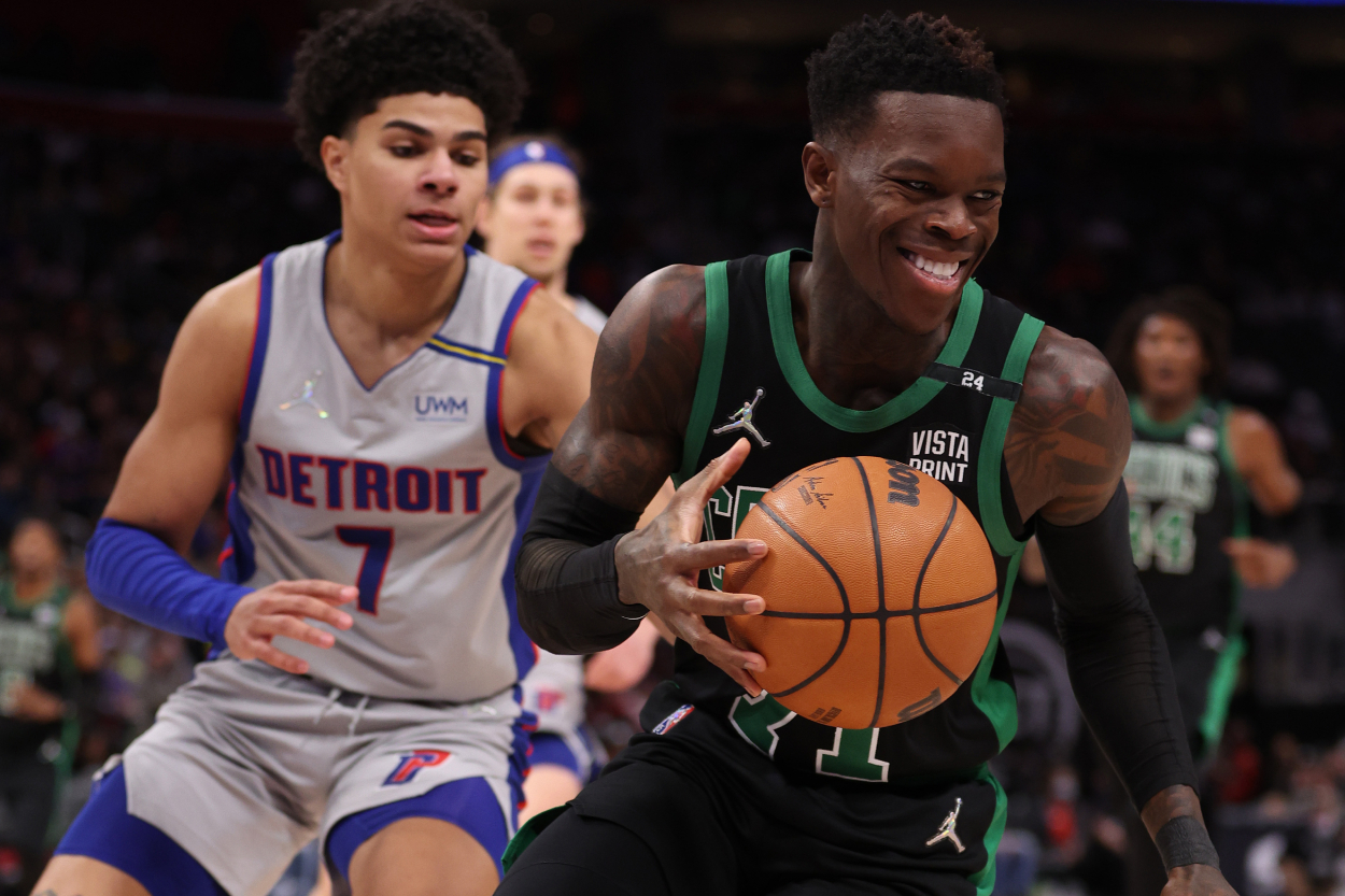 Boston Celtics point guard Dennis Schroder dribbles away from Detroit Pistons guard Killian Hayes during the second half at Little Caesars Arena on February 04, 2022 in Detroit, Michigan. Boston won the game 102-90.