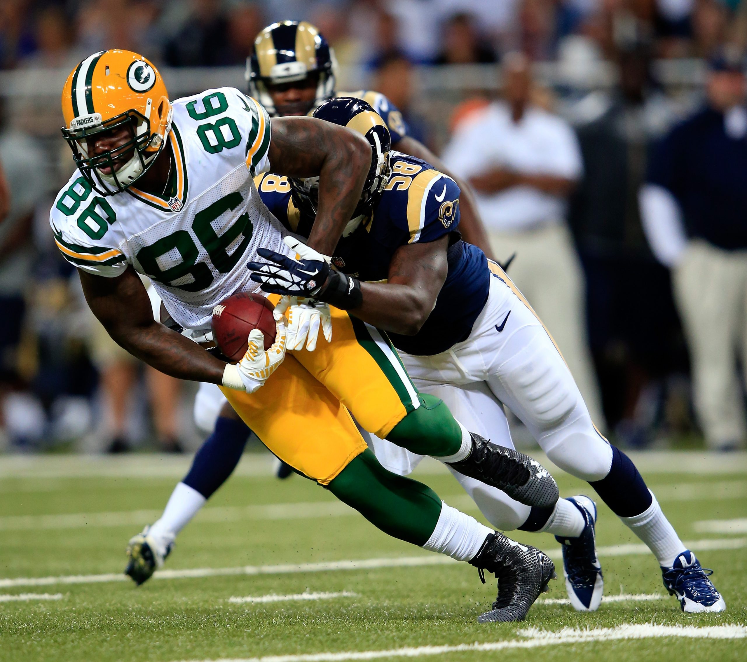 Brandon Bostick of the Green Bay Packers carries the ball upfield.