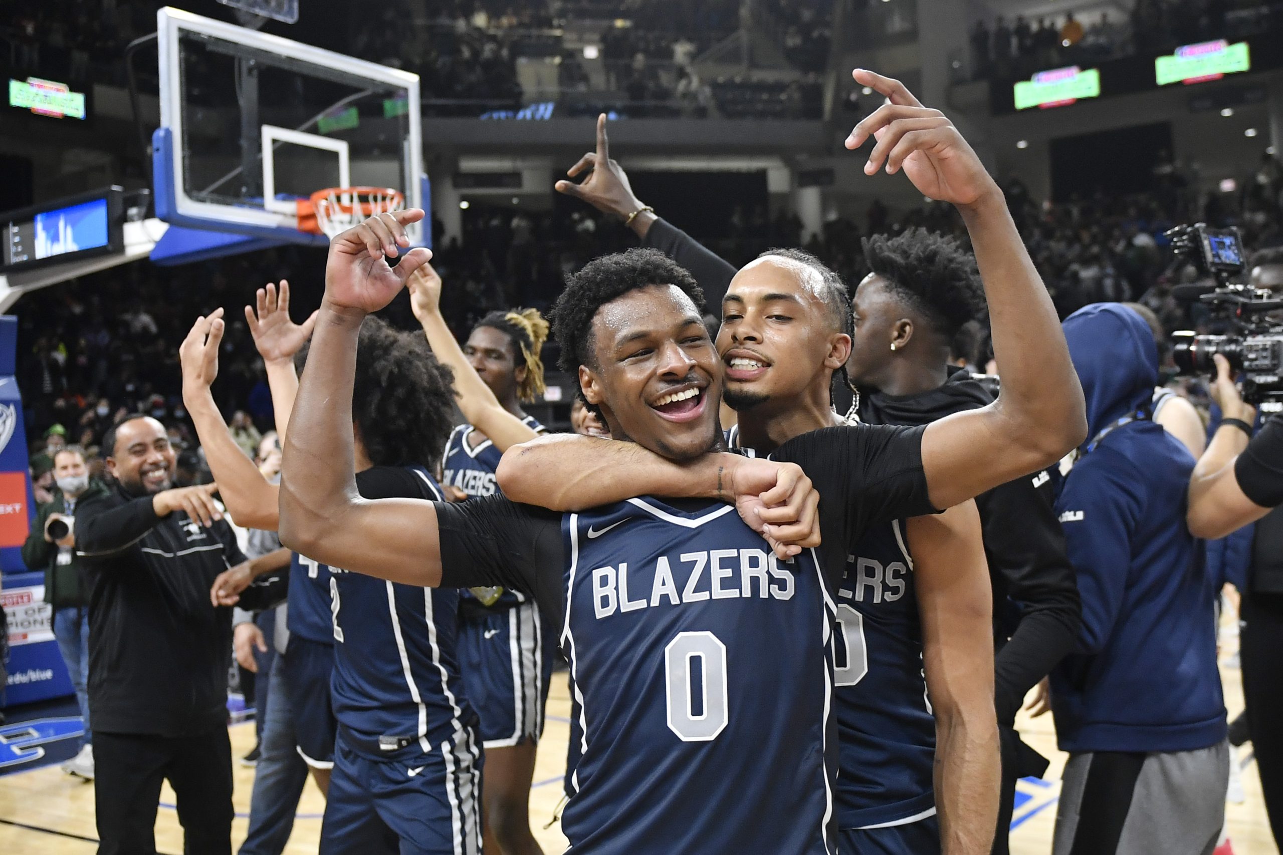 Bronny James #0 and Amari Bailey #10 of Sierra Canyon HS celebrate after defeating Glenbard West HS at Wintrust Arena on February 05, 2022. in Chicago, Illinois.