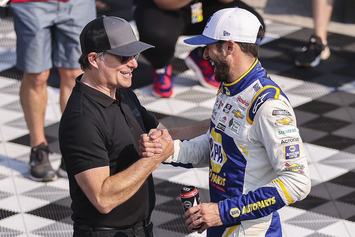Jeff Gordon congratulates Chase Elliott for his victory in the NASCAR Cup Series Jockey Made in America 250 at Road America on July 4, 2021, in Elkhart Lake, Wisconsin. | James Gilbert/Getty Images