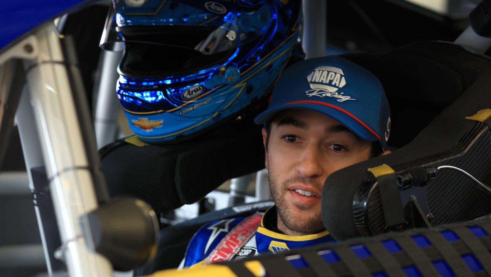 Chase Elliott, driver of the No. 9 Chevrolet, sits in his car in the garage during practice for the Daytona 500 at Daytona International Speedway on Feb. 19, 2022.