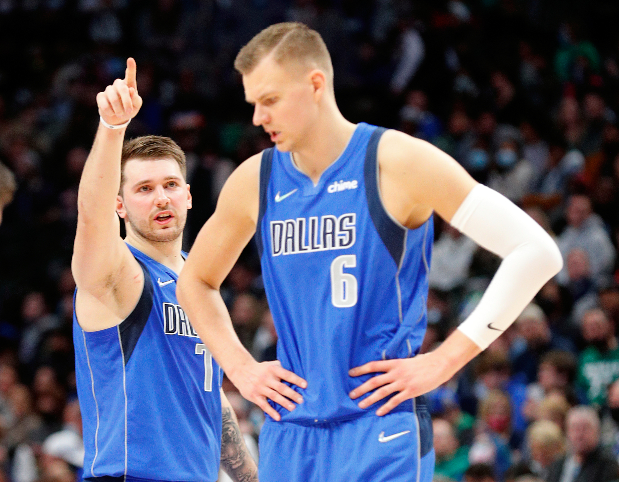 Dallas Mavericks superstar guard Luka Doncic gestures as he talks to now former teammate Kristaps Porzingis in the first half against the Phoenix Suns at American Airlines Center on January 20, 2022 in Dallas, Texas.