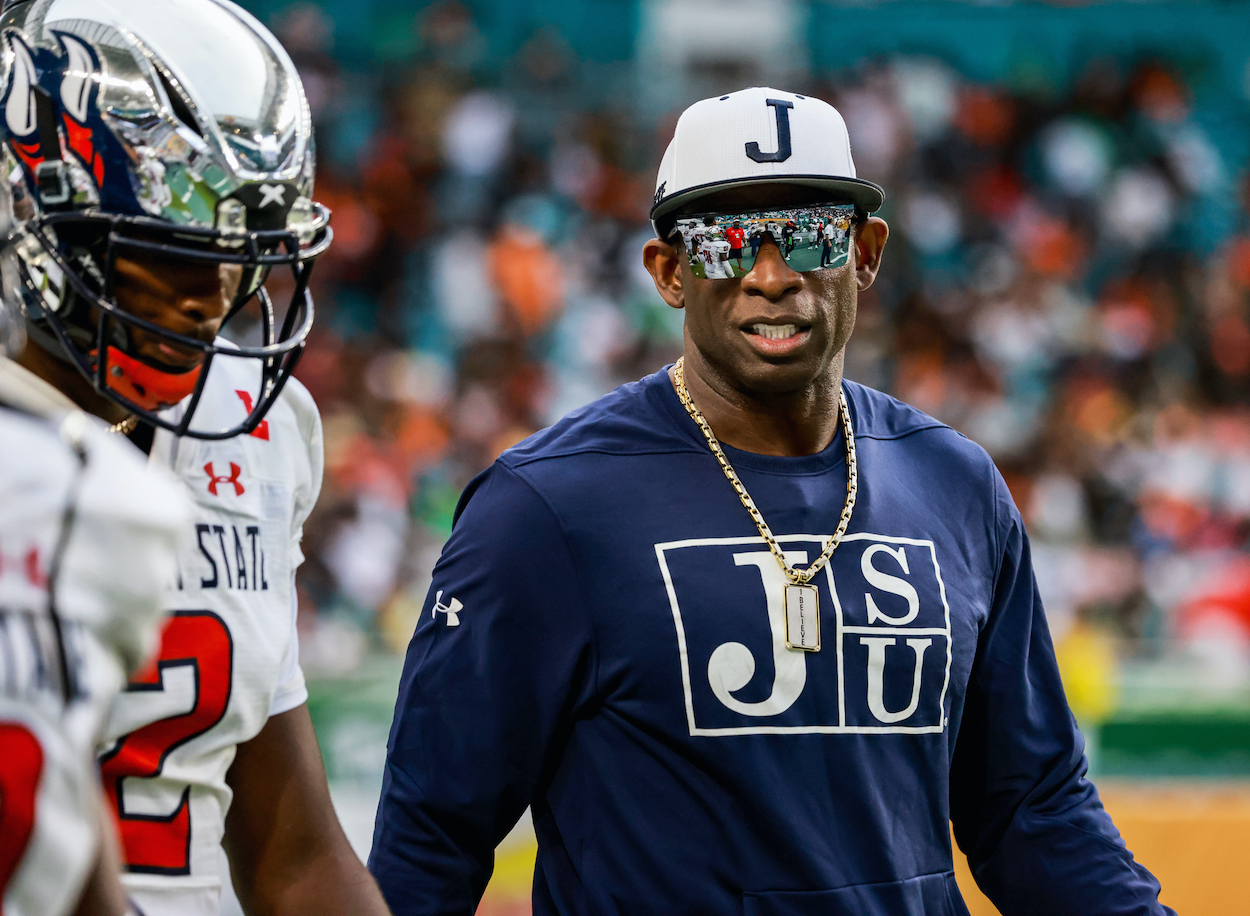 Coach Deion Sanders talks with his son, Shadeur Sanders, JSU QB before the start of the second half of the game against Florida A&M. Shaquille O'Neal thinks Deion should be the next coach of the Dallas Cowboys.
