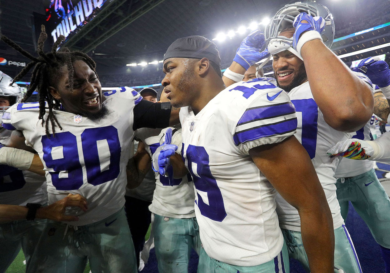 Cowboys players Demarcus Lawrence and Amari Cooper.