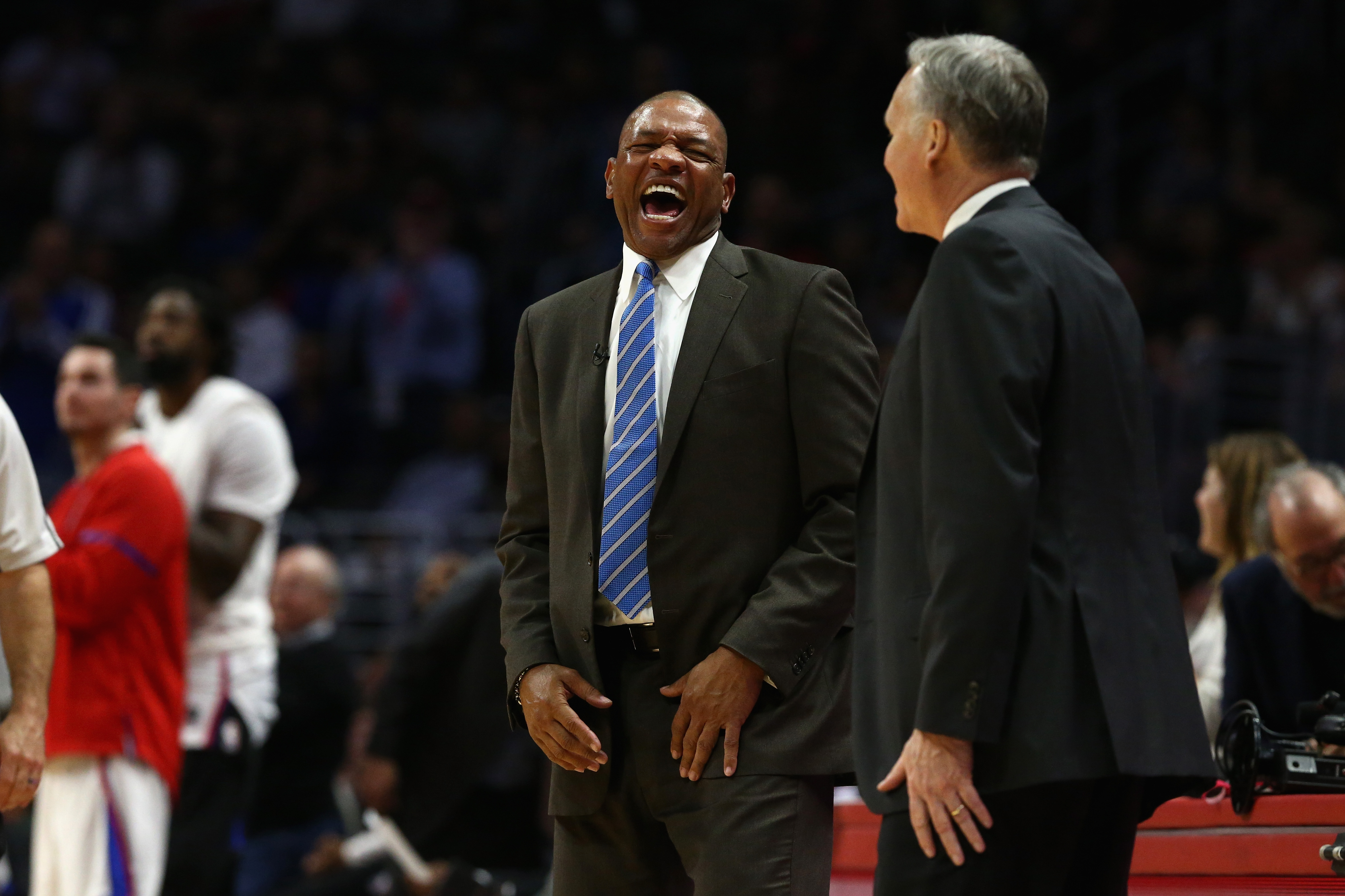 Philadelphia 76ers head coach Doc Rivers shares a laugh with Mike D'Antoni during an NBA game in 2017