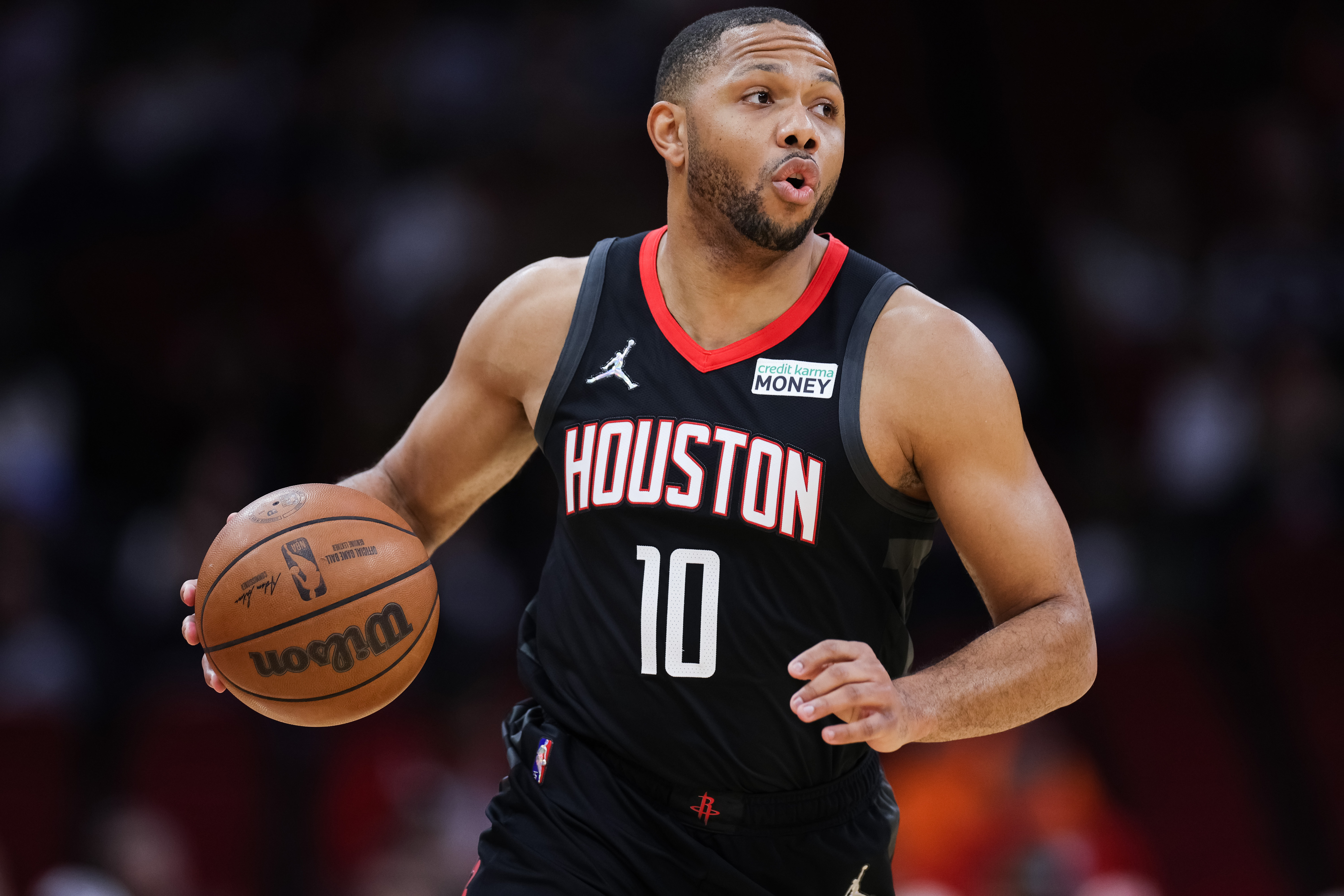Houston Rockets swingman Eric Gordon dribbles the ball during an NBA game against the San Antonio Spurs