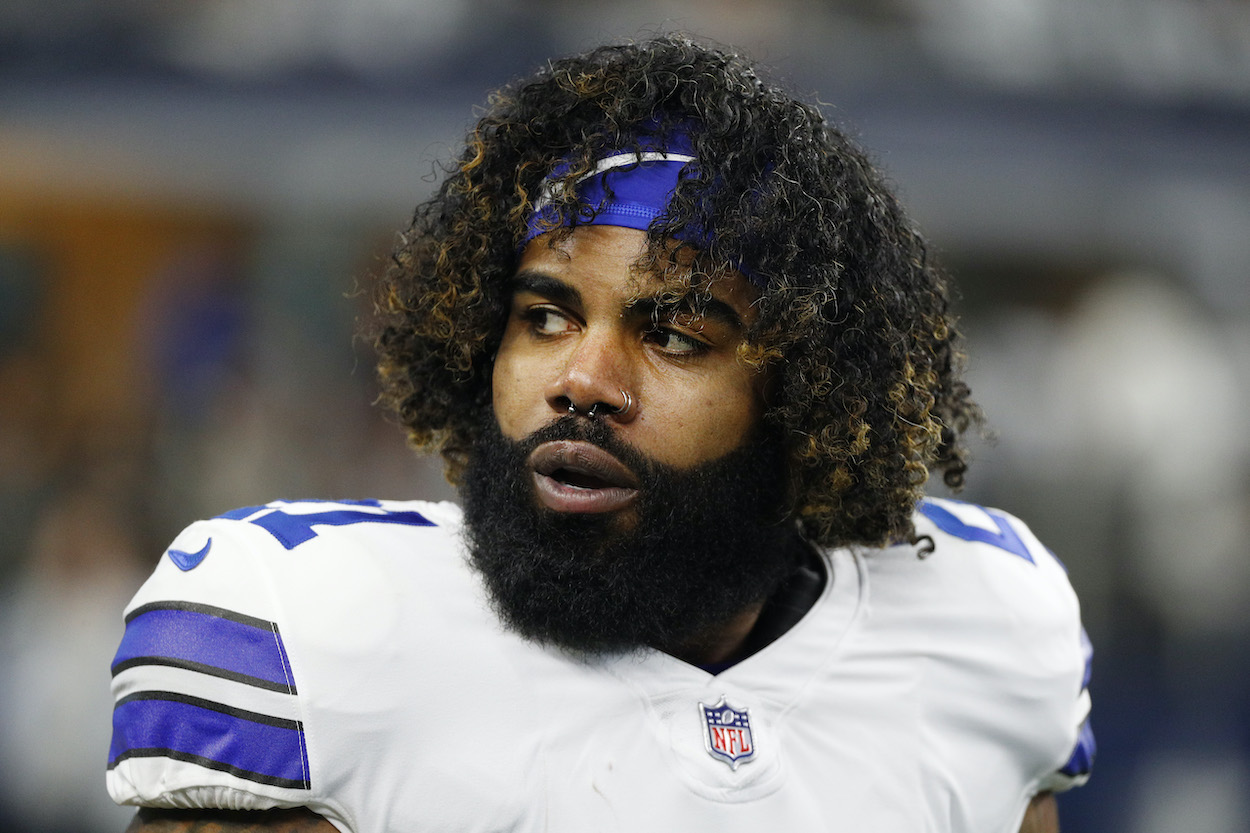 Ezekiel Elliott of the Dallas Cowboys looks on during pregame warm-ups prior to a game against the San Francisco 49ers in the NFC Wild Card Playoff game at AT&T Stadium on January 16, 2022 in Arlington, Texas.