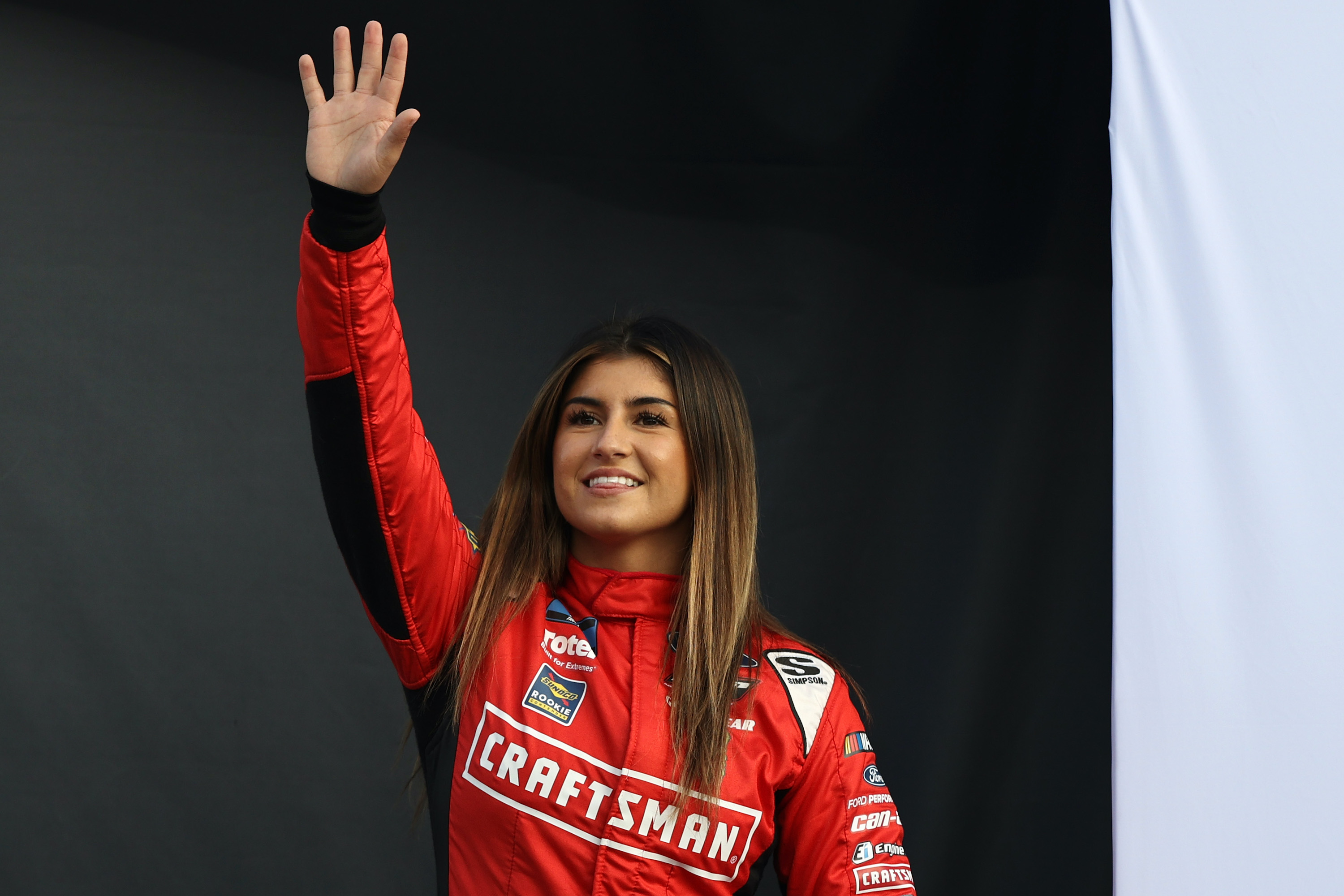 Hailie Deegan waves to crowd