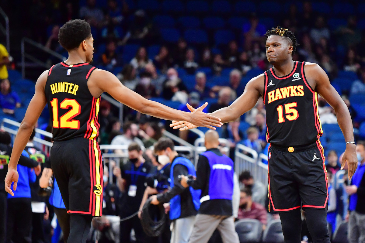 De'Andre Hunter and Clint Capela high-fiving for Atlanta Hawks