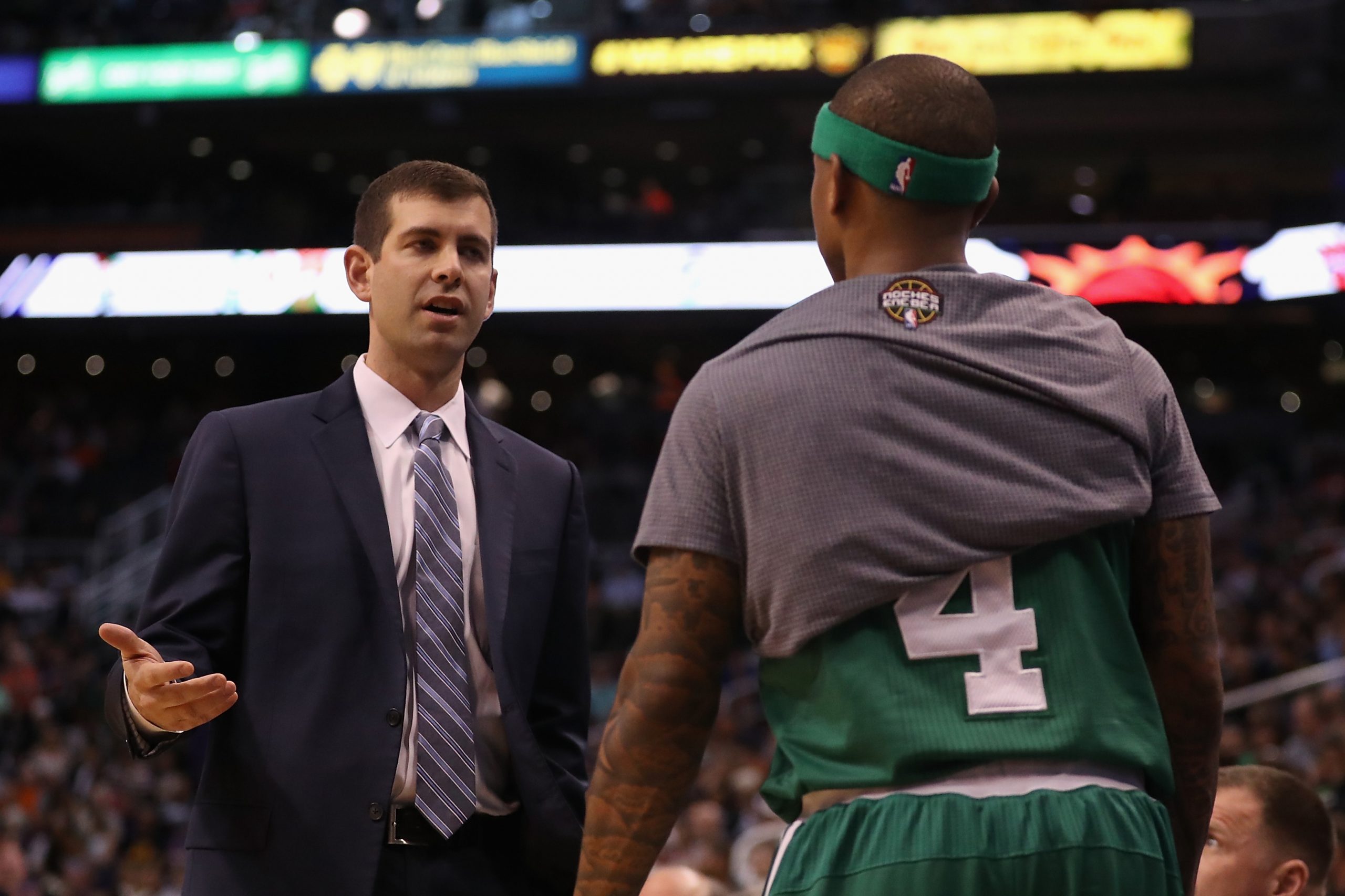 Head coach Brad Stevens of the Boston Celtics talks with Isaiah Thomas.