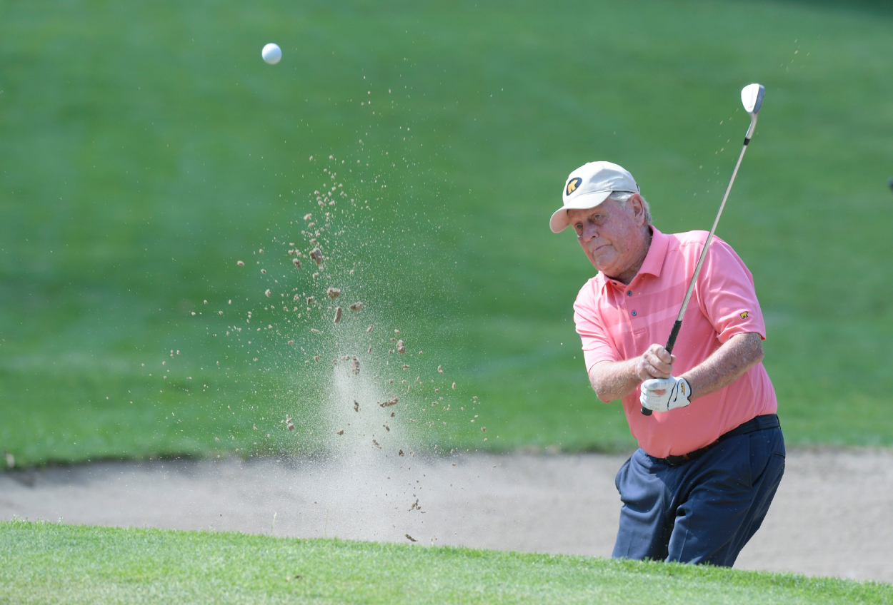 Jack Nicklaus hits a bunker shot on the first hole during the Ally Challenge Celebrity Charity golf match.