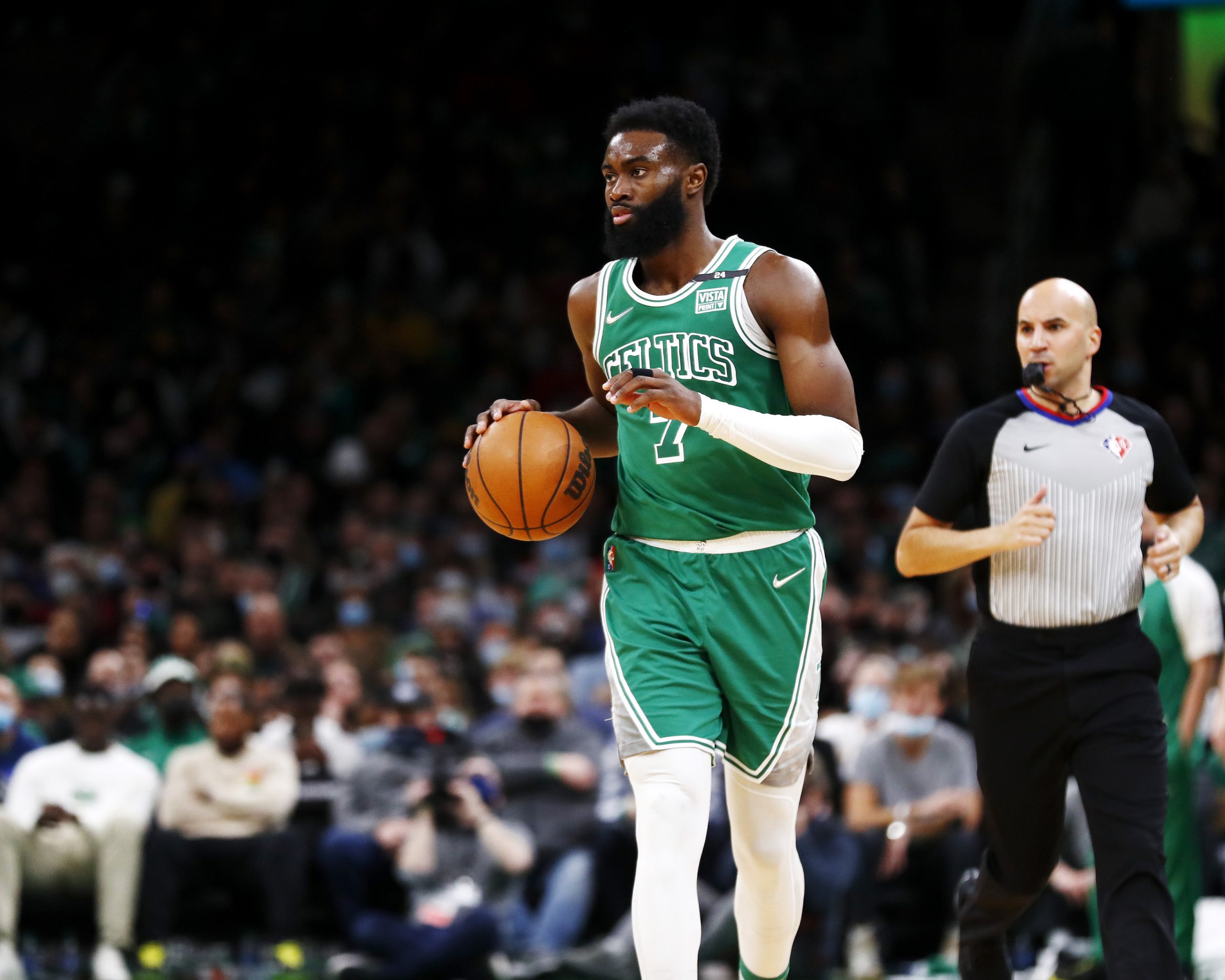 Boston Celtics swingman Jaylen Brown dribbles the ball up the floor during an NBA game against the Miami Heat